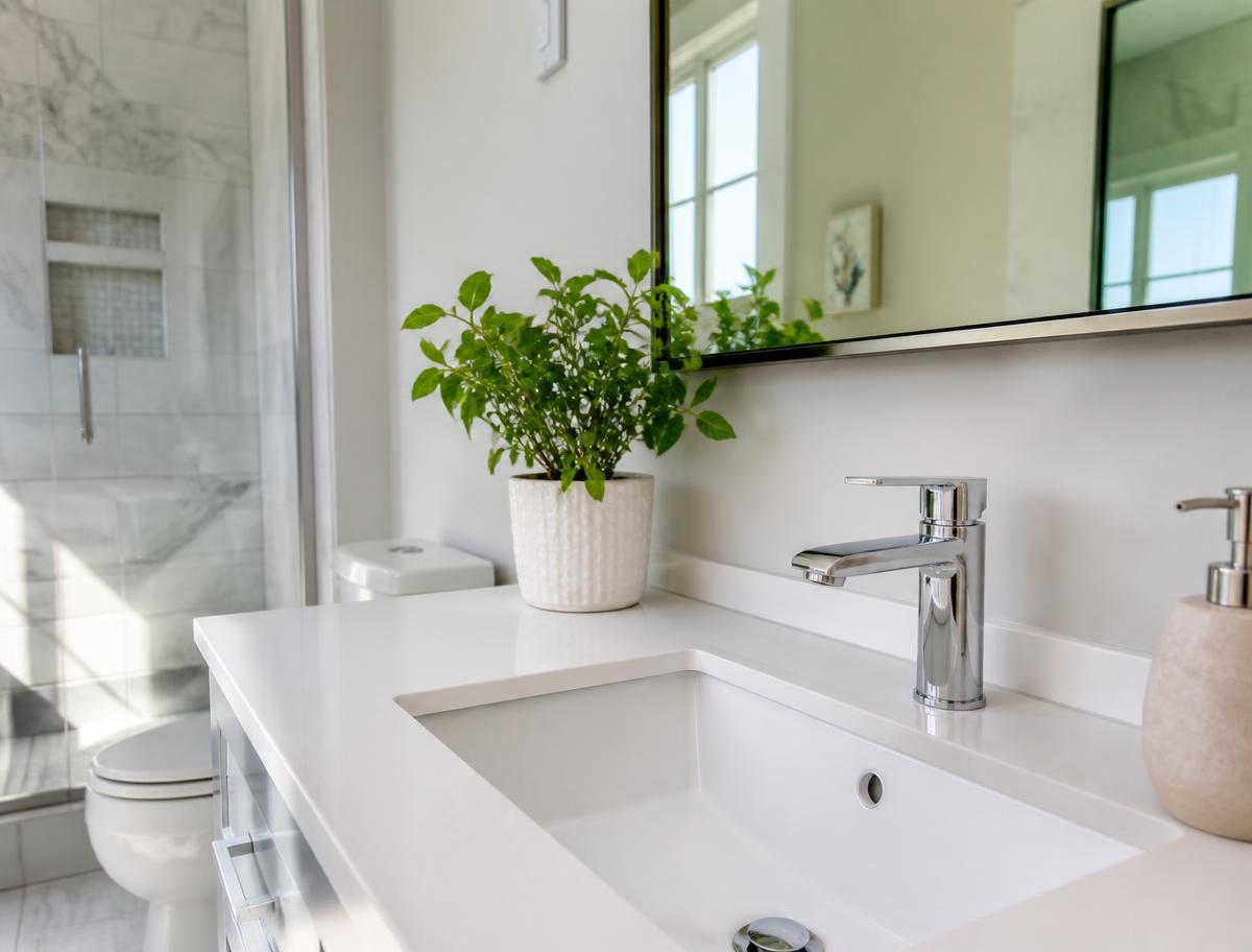 Newly installed bathroom faucet and sink by Prime Plumbers